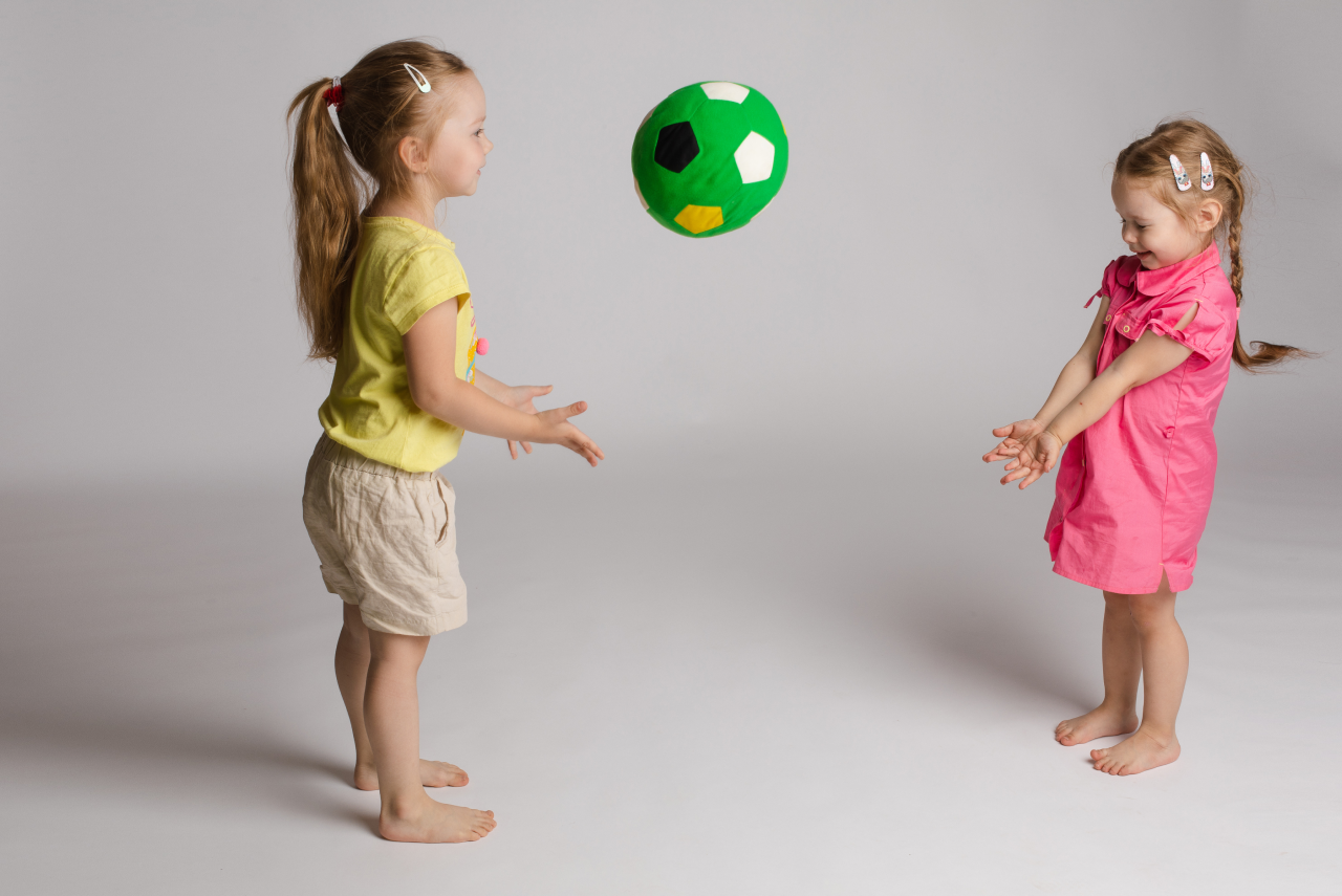 ccheerful-kids-throwing-catching-ball-concept-happiness-game 1.png