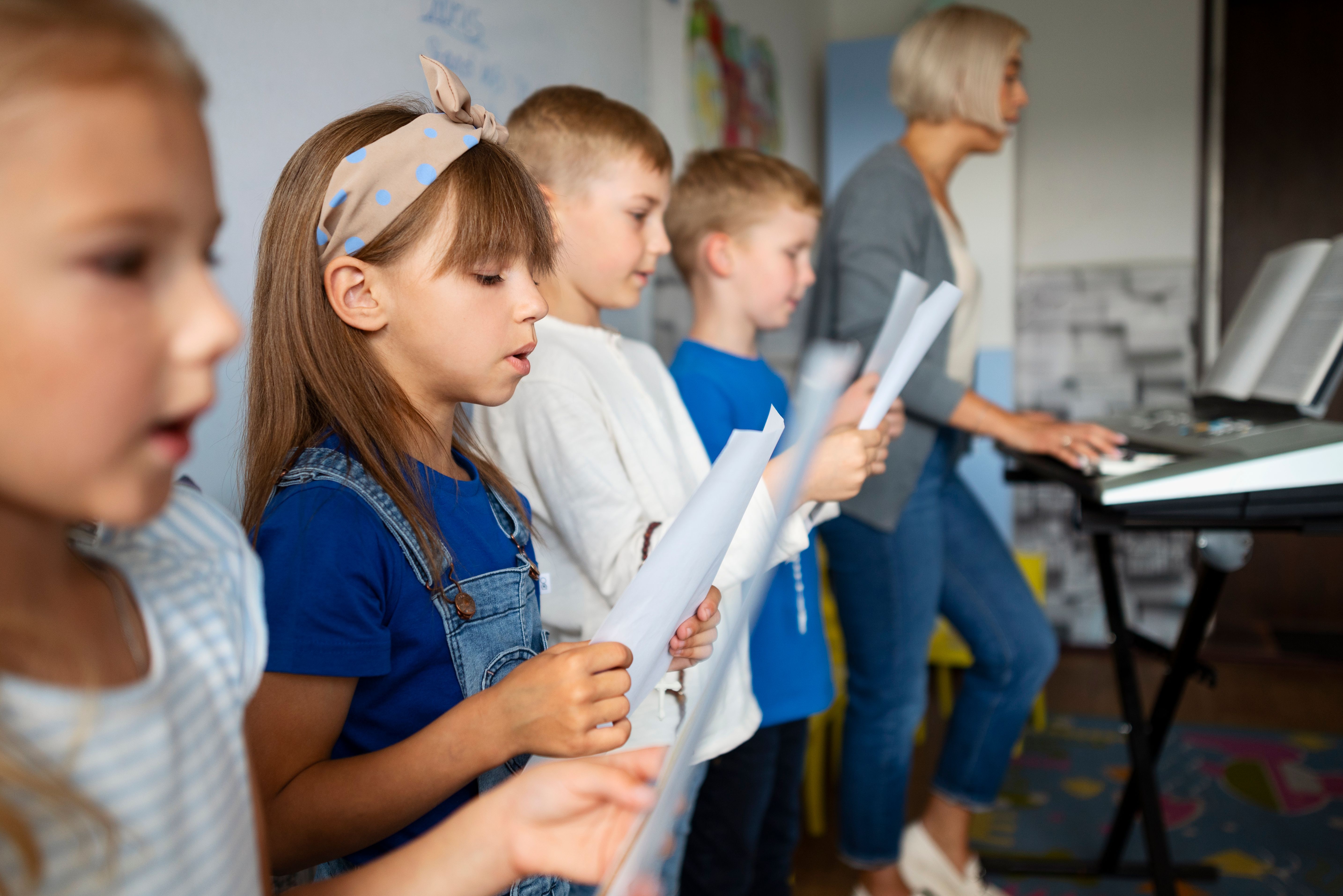 side-view-kids-singing-together-sunday-school (1).jpg